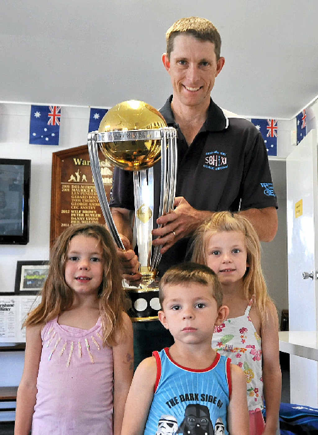 Wheatvale all-rounder Neil Cantwell holds the trophy with his children Claire, William and Carly. Wheatvale all-rounder Neil Cantwell holds the trophy with his children Claire, William and Carly.